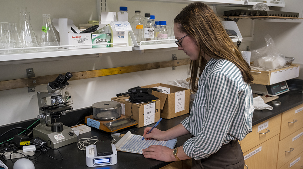 Emma McBride working in a campus lab